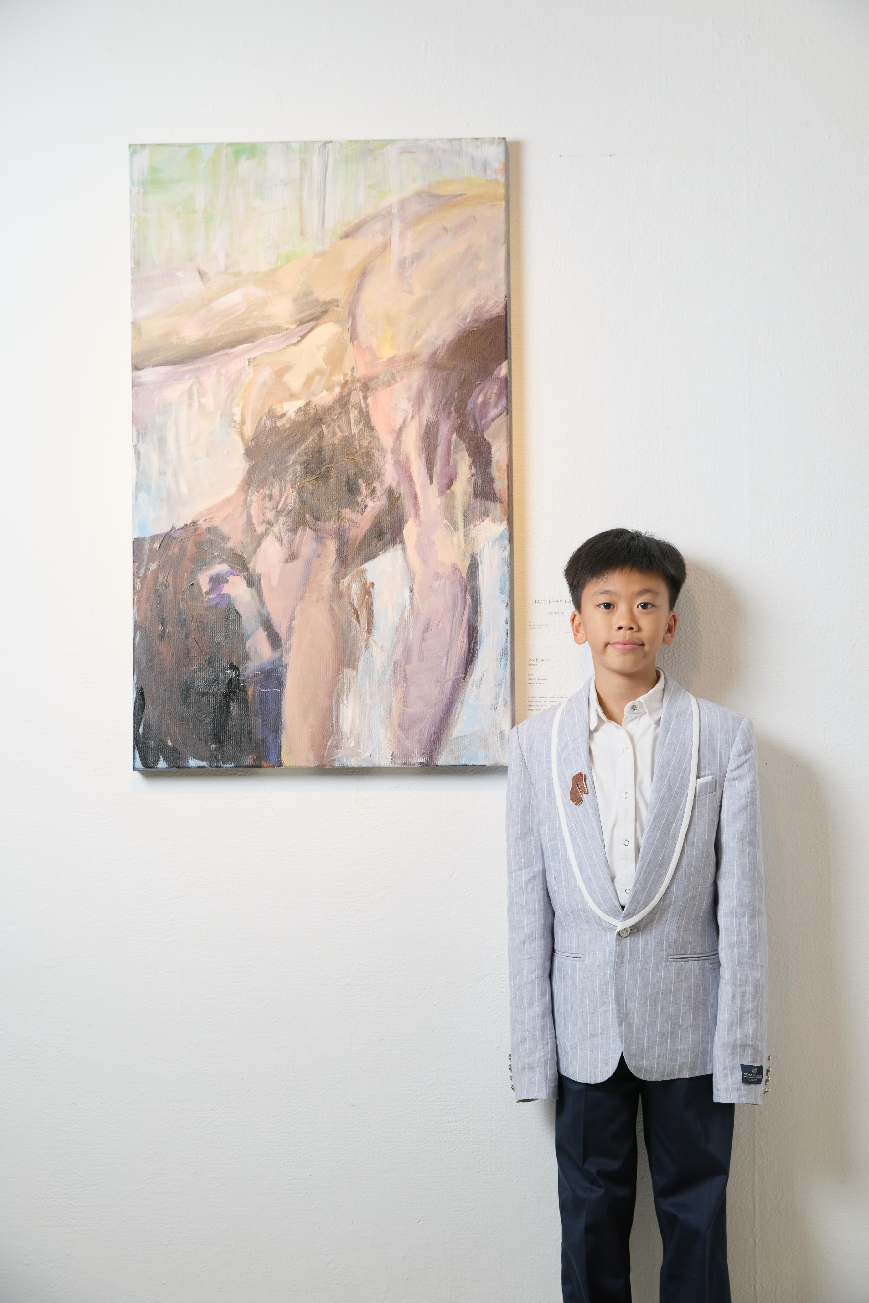 Jace Bean Lau standing beside FLOW OF ENERGY