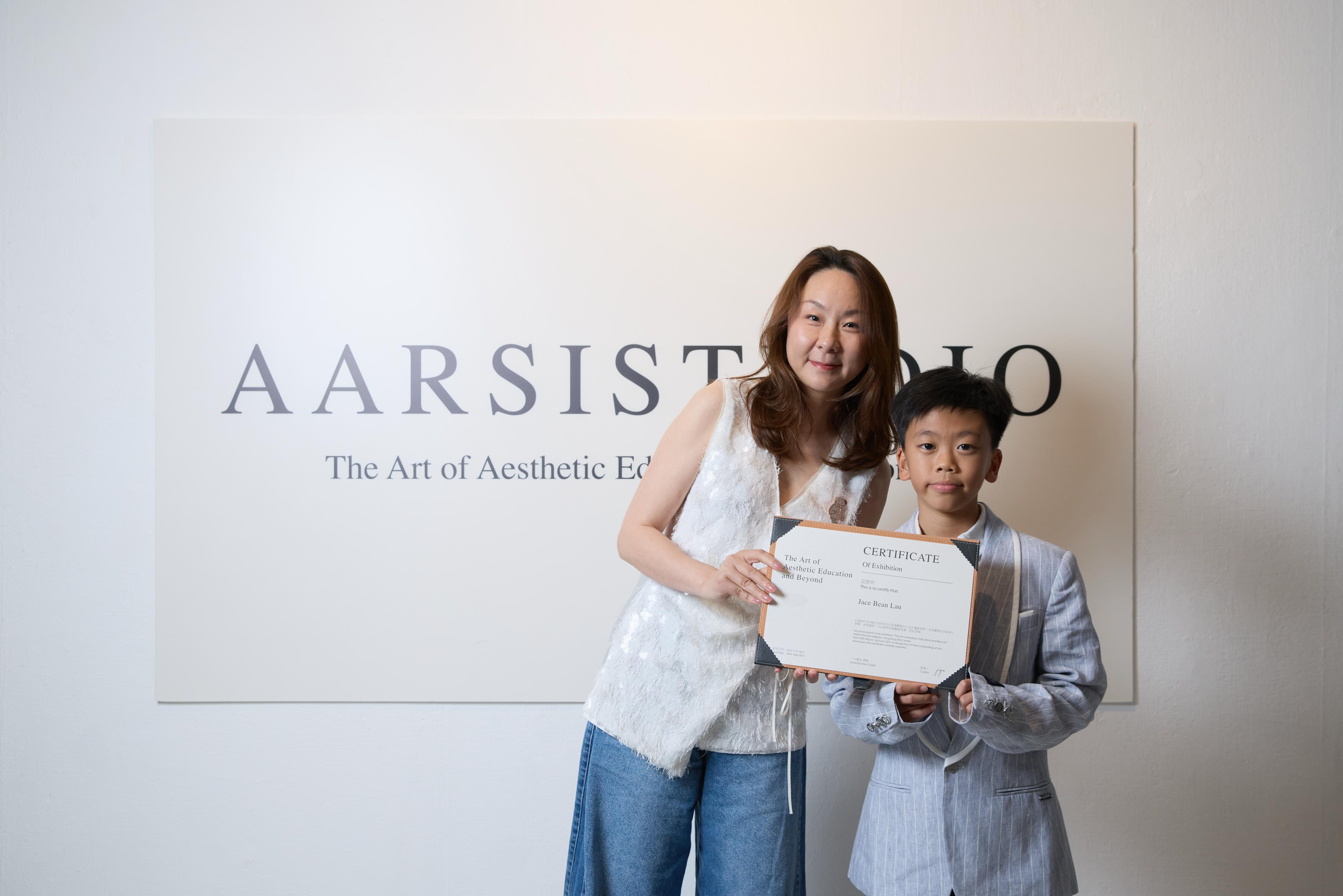 Jace Bean Lau at Aarsistudio with a certificate from The Art of Aesthetic Education and Beyond